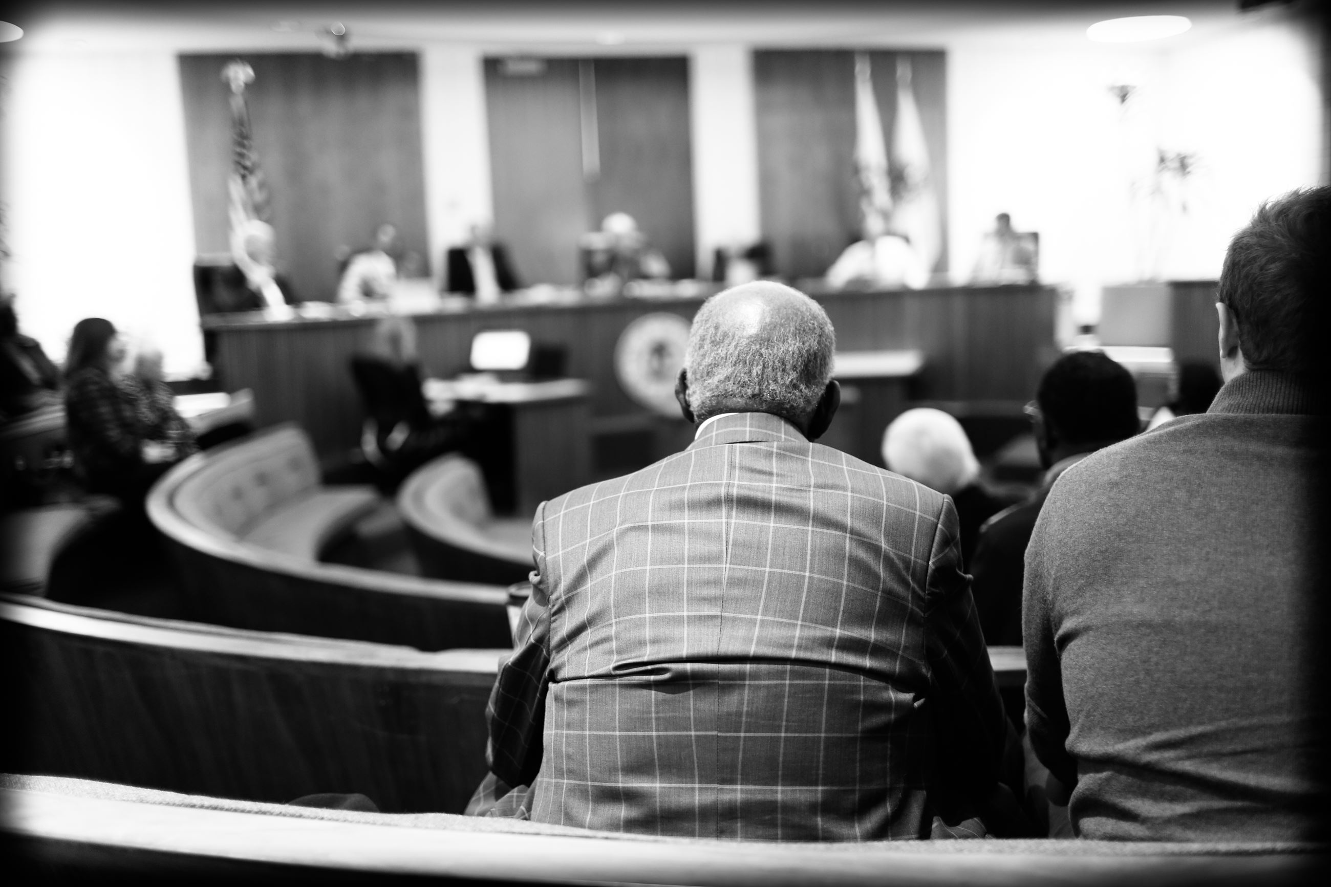 Audience members at council meeting